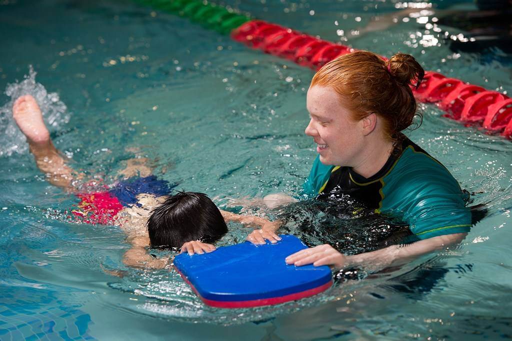 Child learning how to swim