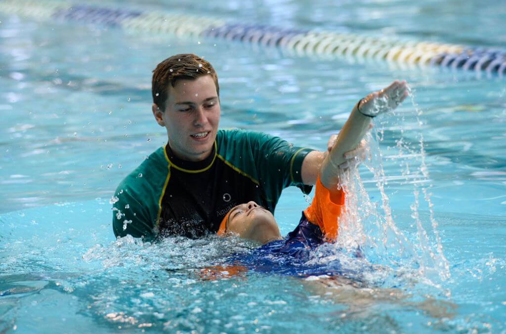 Image of swimming instructor and student in the pool 