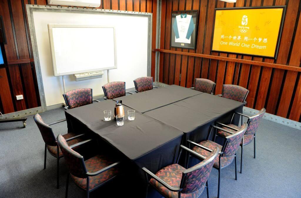 Image of table and chairs in a boardroom